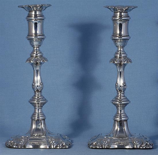 A pair of Edwardian silver candlesticks, Height 240mm, weighted.